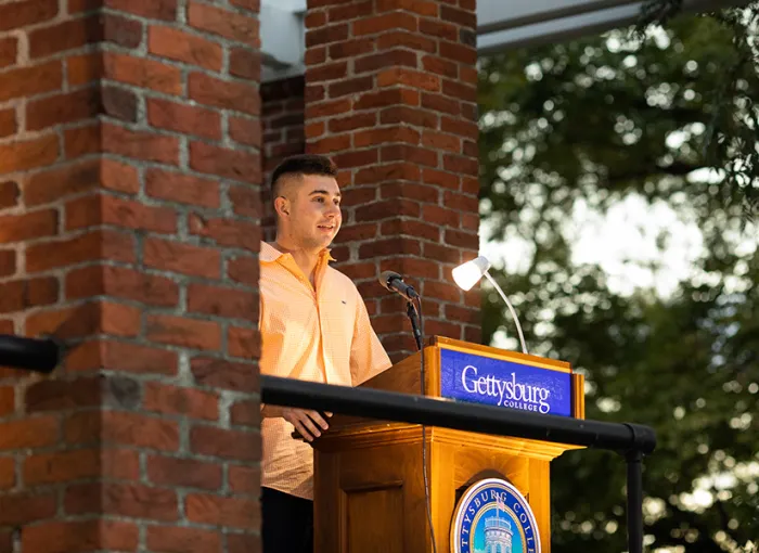 standing at podium