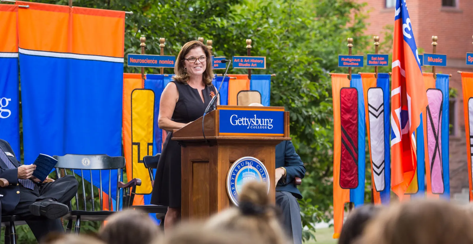 Professor Anne Douds speaking from a podium