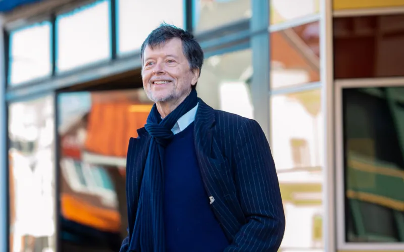 Ken Burns poses and smiles