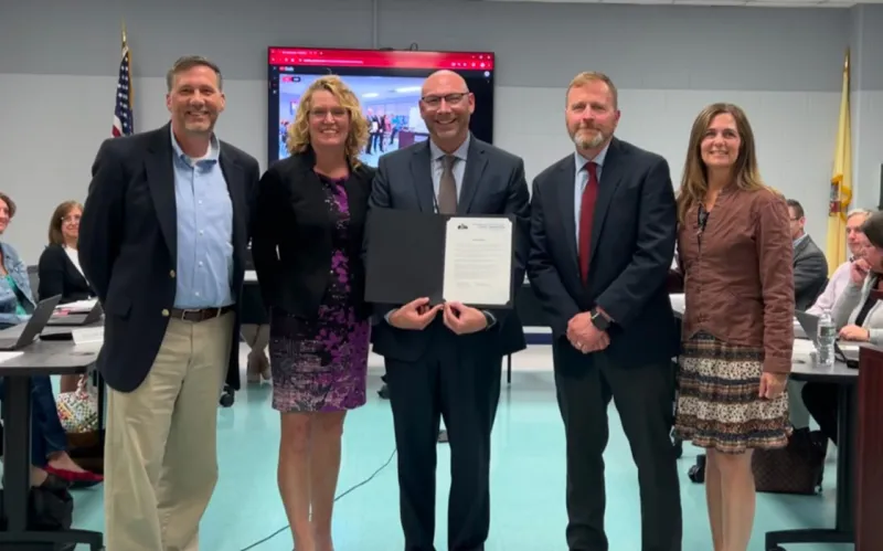 Hart at a school board meeting after receiving his award.