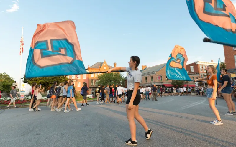 An image of flag bearers waving Gettysburg banners