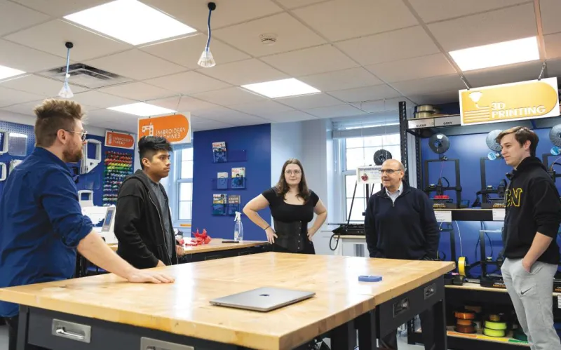 Gettysburg College President Bob Iuliano meets with students in the Rogers Center for Innovation and Creativity.